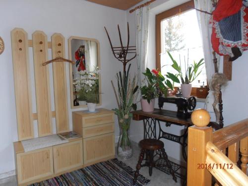 a room with a dresser and a desk and a mirror at Ferienhaus Andrä in Hermagor