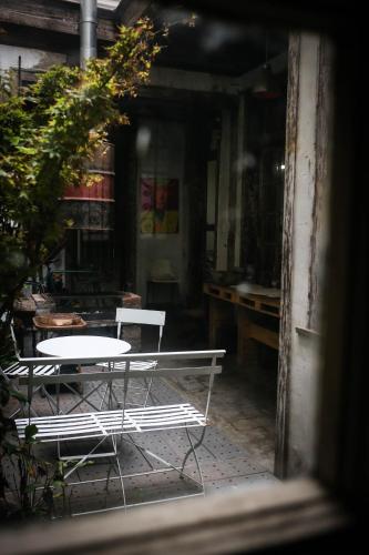 a table and chairs sitting outside of a building at CASA LUCRECIA in Santiago