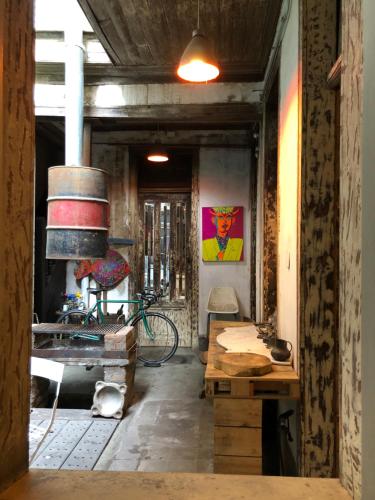 a hallway with a table and a bike in a room at CASA LUCRECIA in Santiago