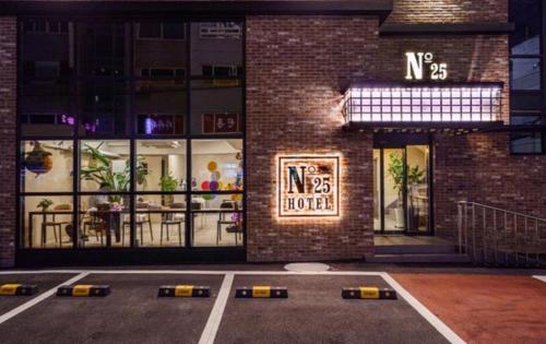 a building with a sign on the front of it at Number25 Hotel Namchuncheon in Chuncheon