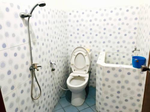 a small bathroom with a toilet and a shower at Dehome near Pakuwon Mall in Surabaya