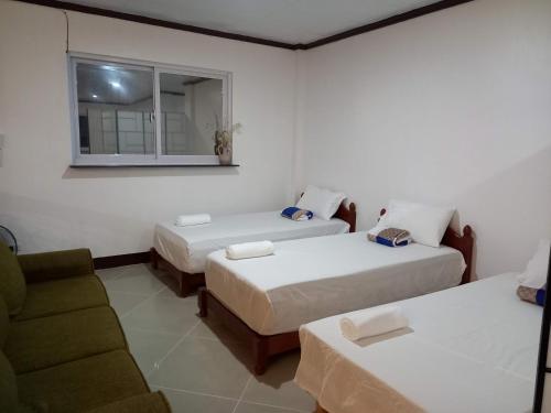 Seven Waves Beachfront Residenceにあるベッド