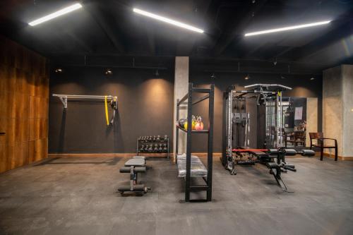 a gym with dumbbells and equipment in a room at Morph Candelaria - Gestion Hotelera in Bogotá