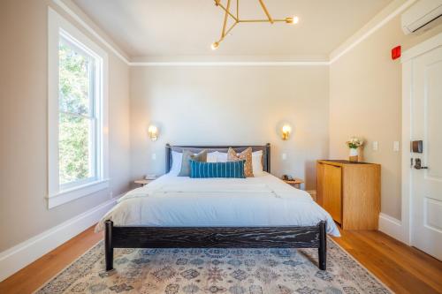 a bedroom with a large bed and a window at The Ruse in Healdsburg