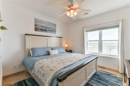 a bedroom with a bed and a ceiling fan at Galveston Luxury High Rise Oceanfront in Galveston