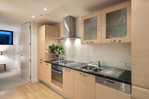 a kitchen with a sink and a counter top at Ocean Eleven 4 in Mount Maunganui