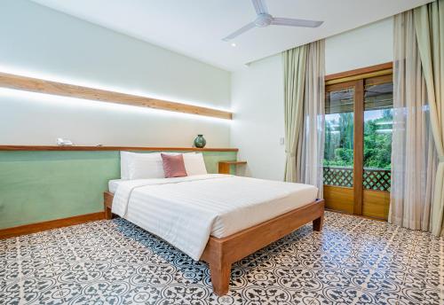Postel nebo postele na pokoji v ubytování Peam Snea Resort