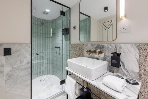 a bathroom with a sink and a shower at 202 Elizabeth in Sydney