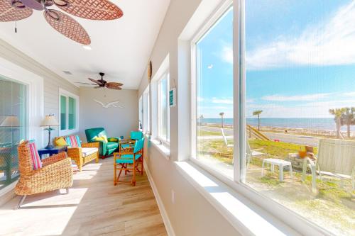 a living room with a view of the ocean at Isle of View Always in Mexico Beach