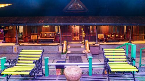 a group of chairs and a table on a patio at Castillo De Woods , The Private Luxury Villa , 8 BHK, Vattavada in Kottakamboor