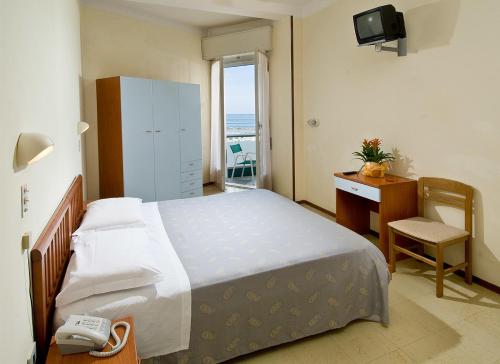 Postel nebo postele na pokoji v ubytování Hotel Flaminio