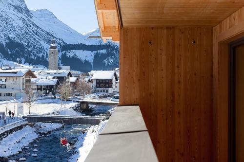 a room with a view of a snowy mountain at Apart-Hotel Laurus Lech in Lech am Arlberg