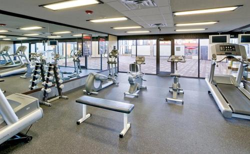 a gym with several treadmills and machines in it at Wyndham Garden Oklahoma City Resort & Conference Hotel Near Airport, Fairgrounds Paycom & I40 in Oklahoma City