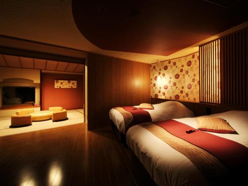 Letto o letti in una camera di Kinugawa Plaza Hotel