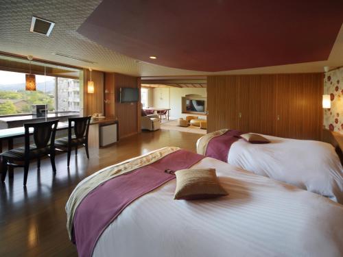 Letto o letti in una camera di Kinugawa Plaza Hotel