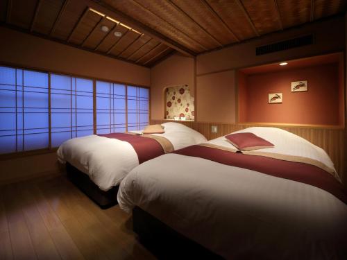 Letto o letti in una camera di Kinugawa Plaza Hotel