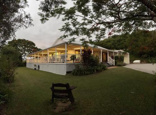 a building with a bench in front of it at Amamoor Homestead and Country Cottages in Amamoor