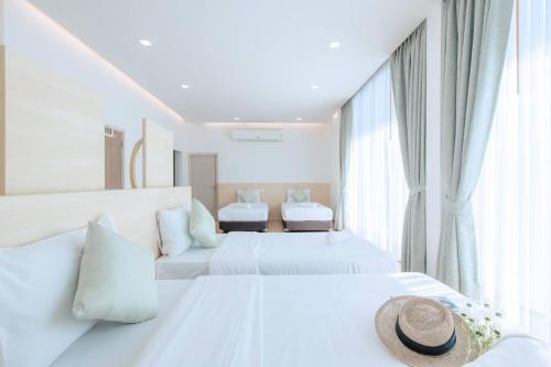 Postel nebo postele na pokoji v ubytování Poollay StayA2 Poolvilla@Pattaya พัทยา