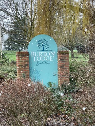 a sign for a union lodge in a garden at Burton Lodge Guest House & Spa in Brandesburton
