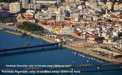 an aerial view of a city with a bridge at Cozy Apartment PORTIMÃO City Center in Portimão