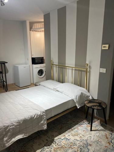 a bedroom with two beds and a stove at Mood-Garibaldi 26 in Pavia