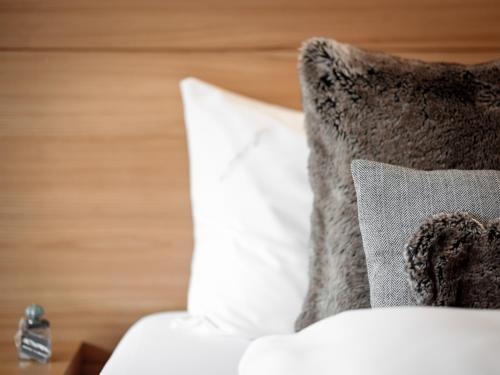Postel nebo postele na pokoji v ubytování Alpen-Comfort-Hotel Central