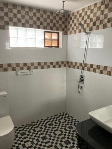 a bathroom with a toilet and a sink at Lily Pad Boutique Hotel in Siem Reap
