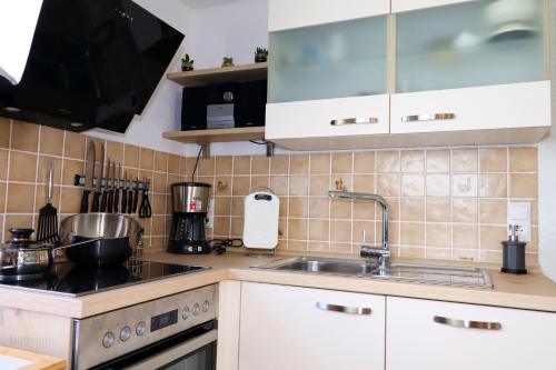 a kitchen with a sink and a counter top at Haus Silvia in Gostorf