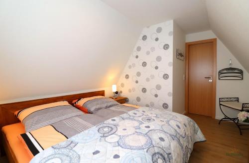 a bedroom with a large bed in a room at Haus Silvia in Gostorf
