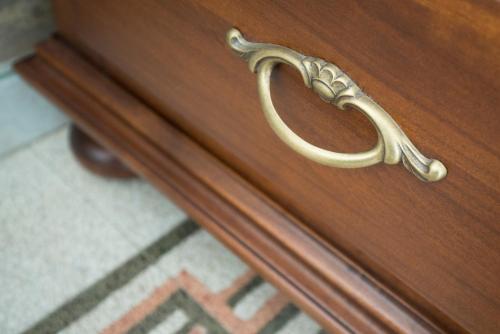 a wooden drawer with a brass handle on it at Villa Liberty Urbino in Urbino
