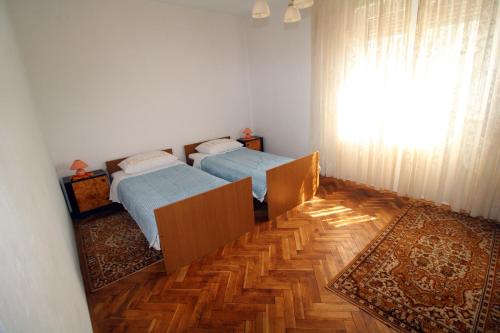 Postel nebo postele na pokoji v ubytování Apartman Moro