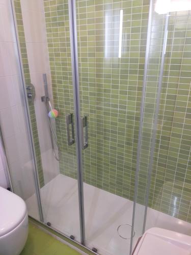 a shower with a glass door next to a toilet at Studio Flat Vista Mare in Trapani