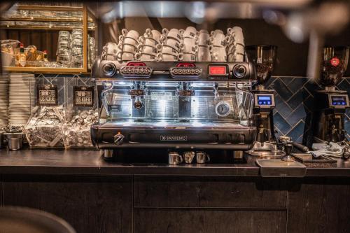 a coffee machine sitting on a counter in a kitchen at Hotel Grandcafe De Doelen in Franeker
