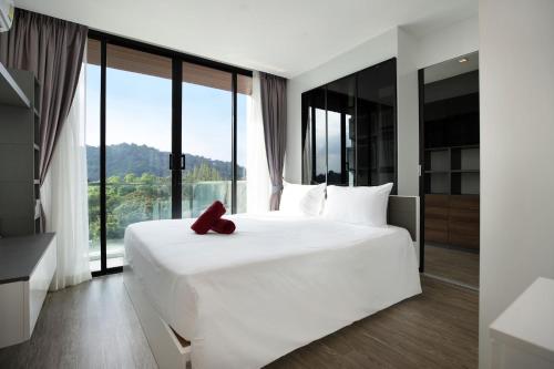 Posteľ alebo postele v izbe v ubytovaní Condo Viva Patong A401