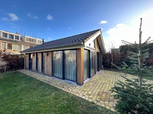 a small house with a pitched roof at Loft Rêve Beek in Beek