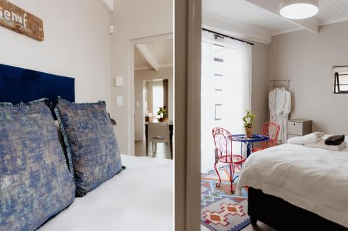 a bedroom with a bed and a room with a table at Into the Mystic in Paternoster