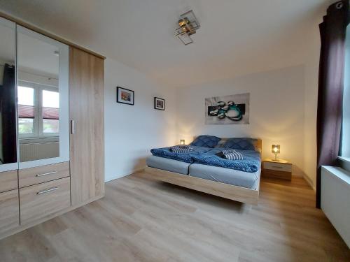 Ένα ή περισσότερα κρεβάτια σε δωμάτιο στο Ferienhaus Hinrichs