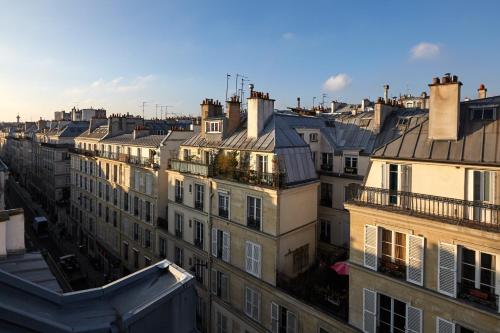 an aerial view of a city with buildings at Grand Hôtel Amelot in Paris