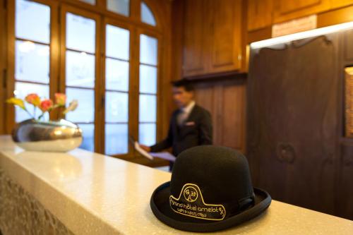 a black hat sitting on top of a kitchen counter at Grand Hôtel Amelot in Paris
