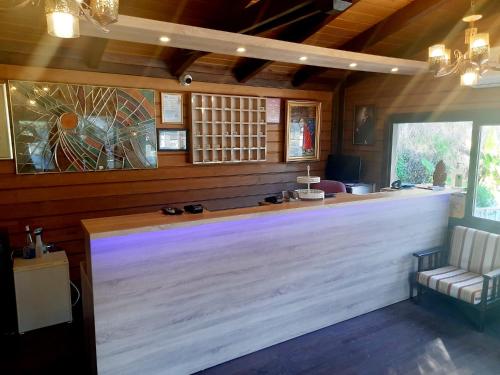 a bar with a white counter in a room at Belle Vue Ölüdeniz in Fethiye