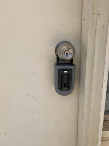 a cell phone is attached to a wall at Chadstone Holiday E2 Villa in Oakleigh