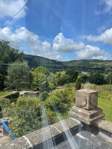 a view of the countryside from the roof of a house at Pentre Cerrig Country House in Llanferres