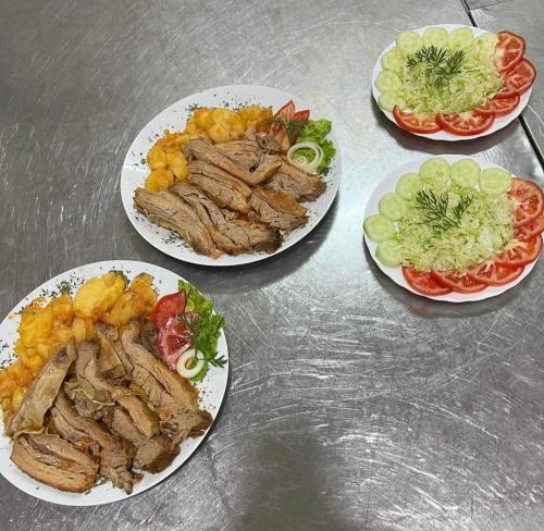 a group of plates of food on a table at Motel HEKO in Bugojno
