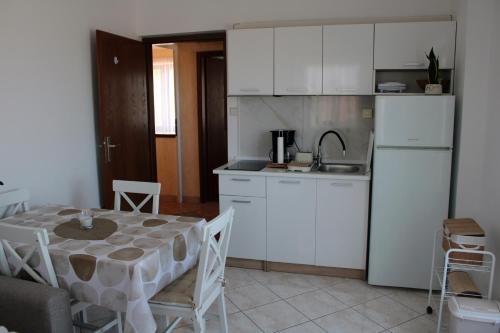 Kuchyň nebo kuchyňský kout v ubytování Apartment Una