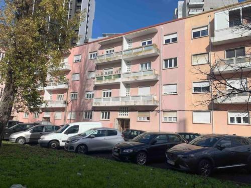 a bunch of cars parked in front of a building at ASF Home in Lisbon