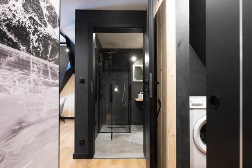 two pictures of a bathroom with a toilet and a door at Villa 84 & Apartments Jacuzzi & Sauna in Zakopane