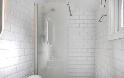 a white bathroom with a shower and a toilet at 2 Bedroom Lovely Home In Jämjö in JÃ¤mjÃ¶