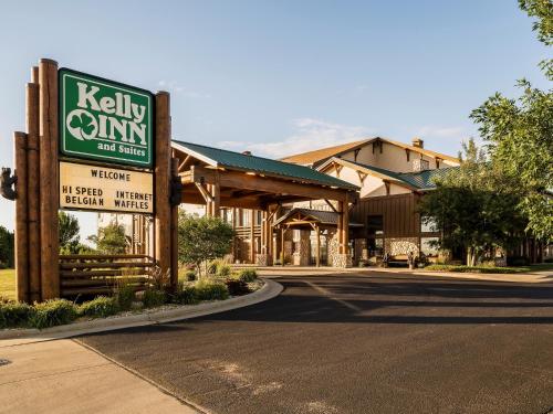 a sign for a killeen gym in front of a building at Kelly Inn and Suites Mitchell in Mitchell