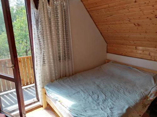 Ένα ή περισσότερα κρεβάτια σε δωμάτιο στο Nešić apartmani, Gornji Gajevi