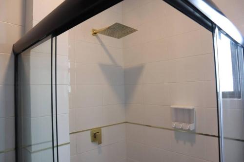 a shower with a glass door in a bathroom at Luxurious and Central Apartment 2Br in Xalapa